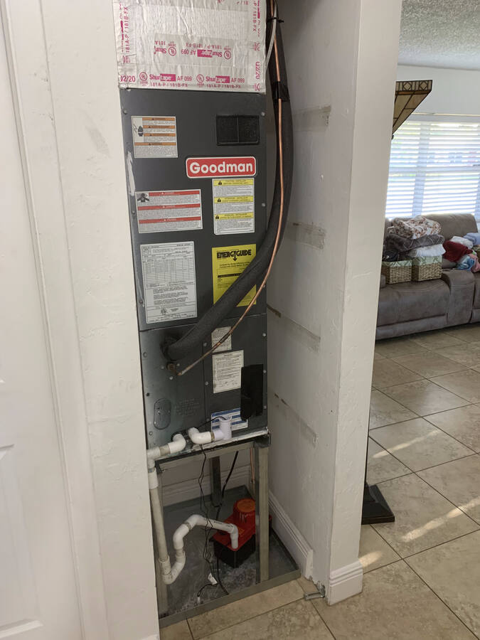 Air handler on stand with condensate pump